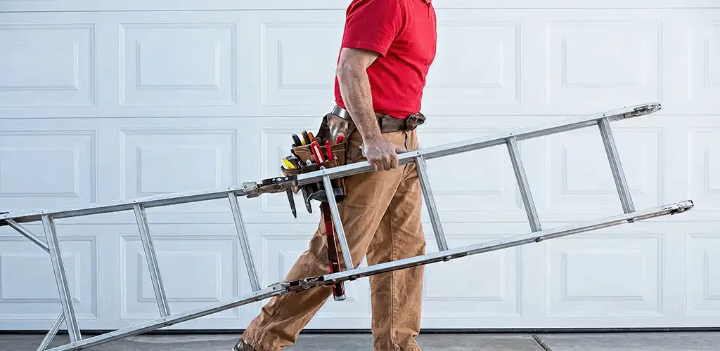 Garage door repair technician arriving with tools and ladder in Nashua, NH