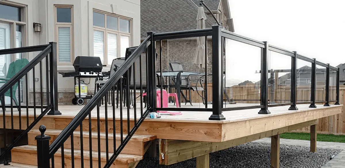 Handrail installation on a deck staircase for safety and code compliance in Nashua, NH