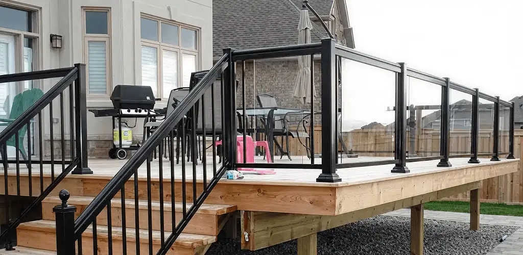 Handrail installation on a deck staircase for safety and code compliance in Nashua, NH